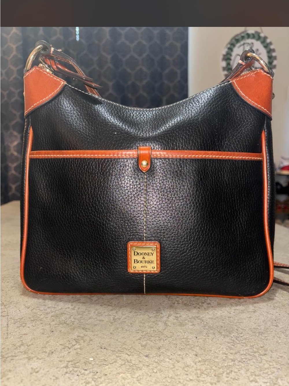 Dooney & Bourke Black with Brown Trim Pebbled Leather Crossbody Bag